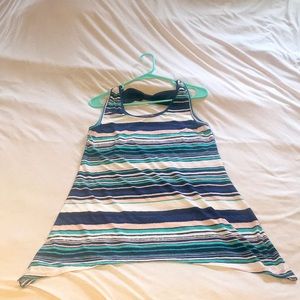 Adorable slinky tank with bow detail.